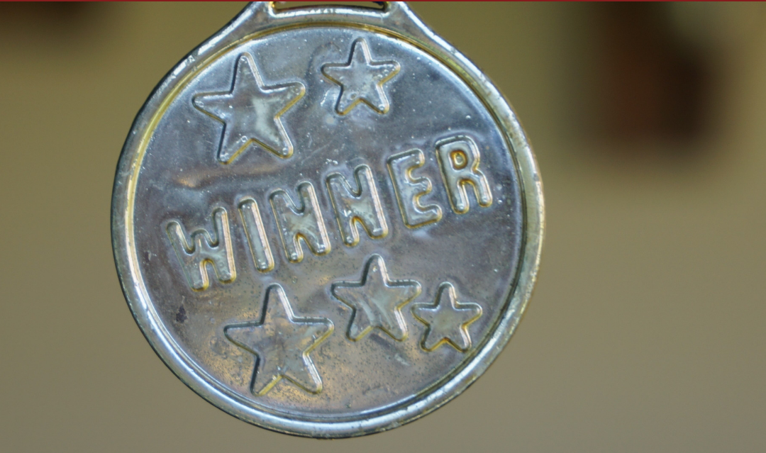 Image of a medal saying "Winner".